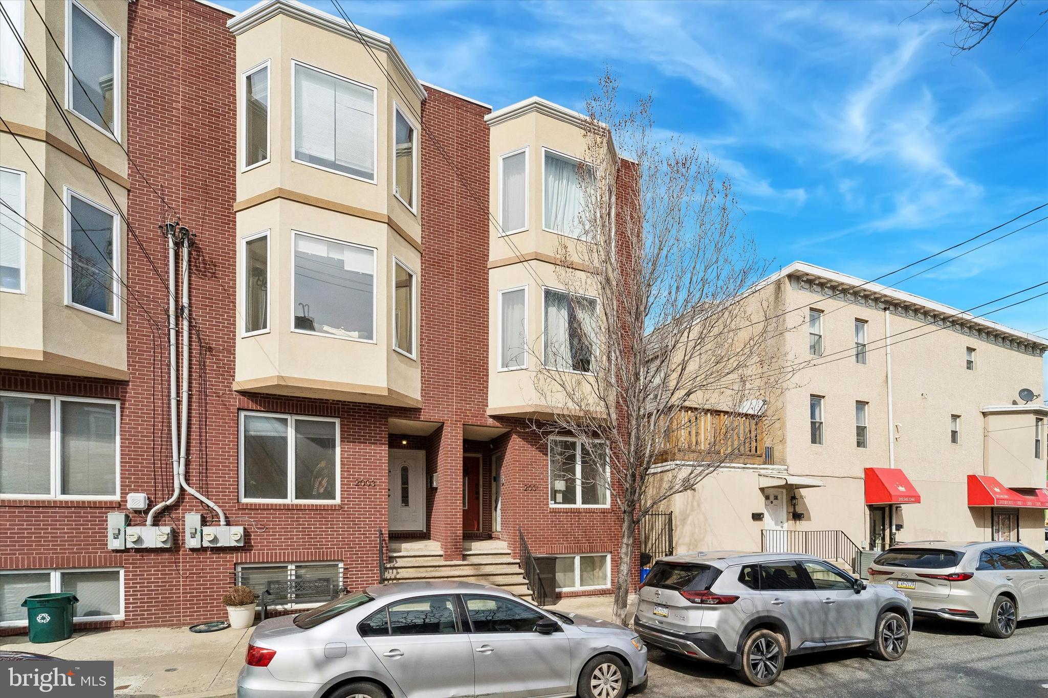 2001 Carpenter Street, Unit B Philadelphia, PA 19146 - Photo 2 of 31 a couple of cars parked in front of a building