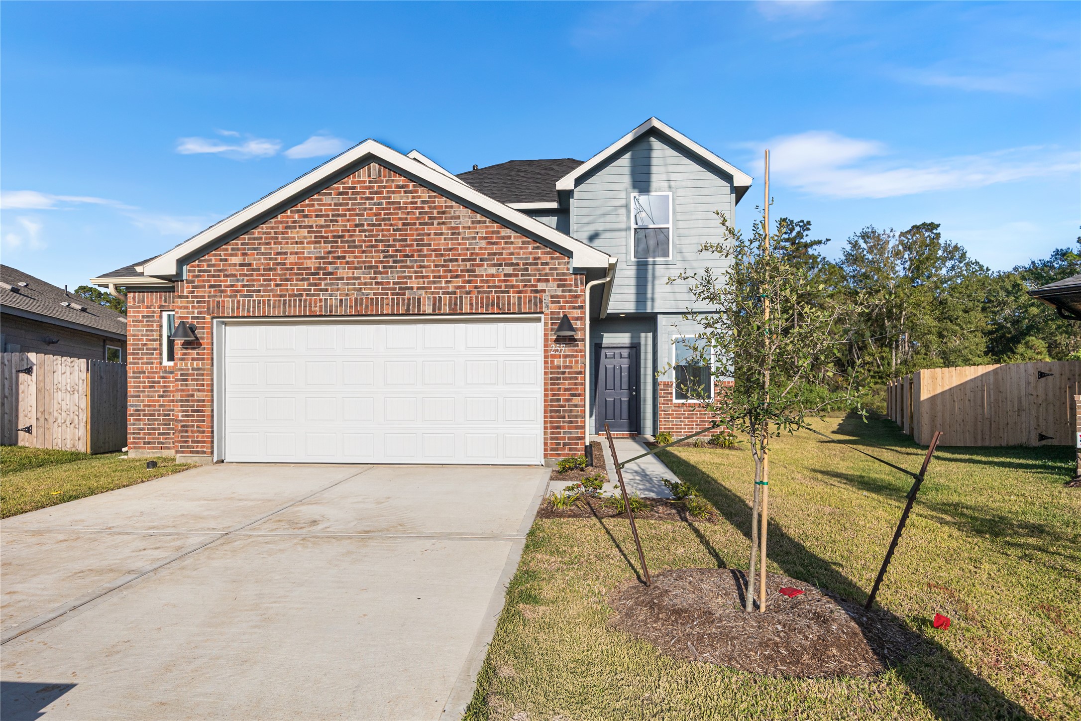 25799 John Wayne Court Splendora, TX 77372 - Photo 1 of 28 a view of backyard of house