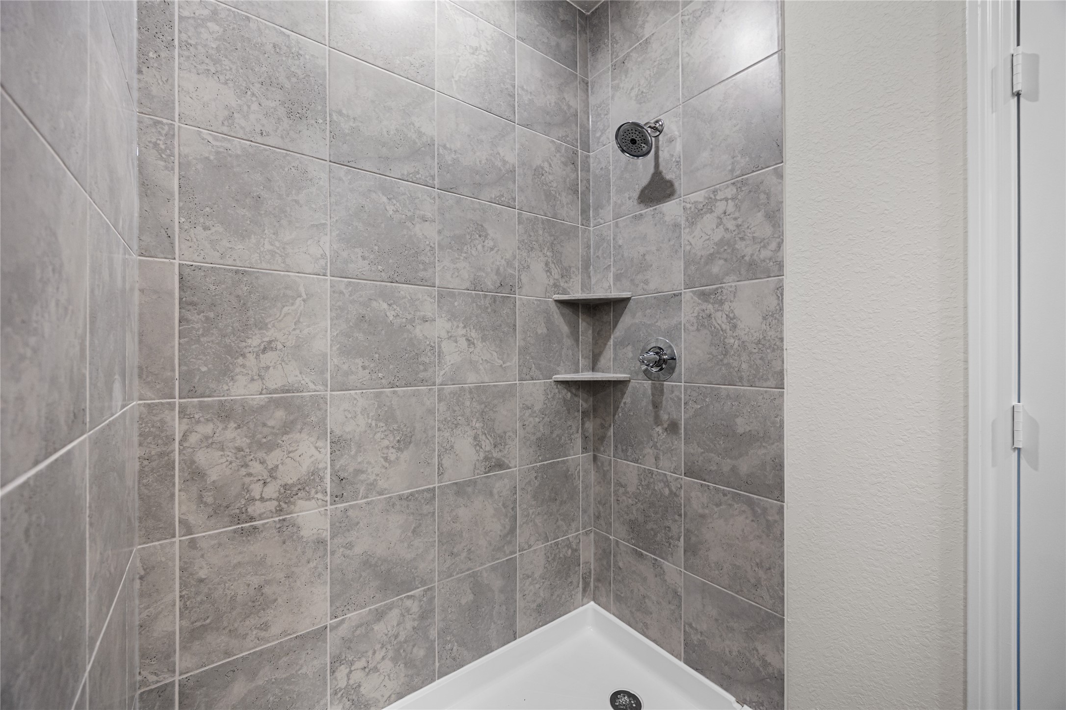 25799 John Wayne Court Splendora, TX 77372 - Photo 18 of 28 a bathroom with a shower