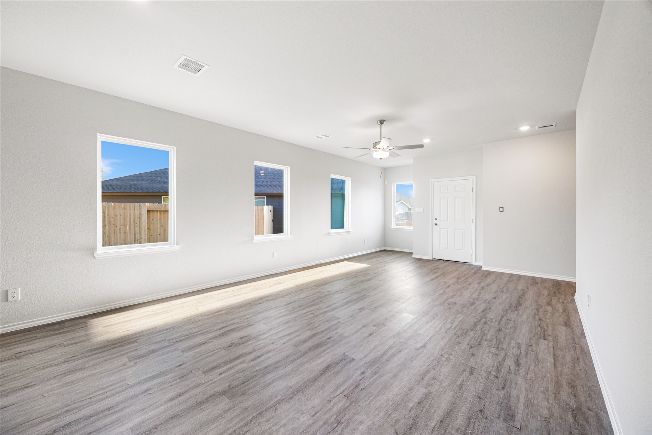 25799 John Wayne Court Splendora, TX 77372 - Photo 20 of 28 a view of an empty room with wooden floor and a window