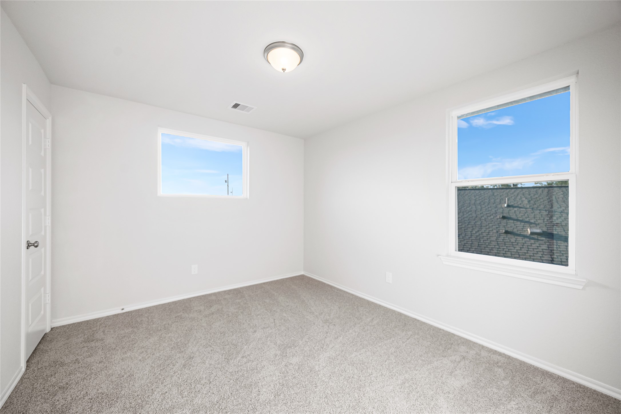 25799 John Wayne Court Splendora, TX 77372 - Photo 25 of 28 a view of an empty room with a fireplace