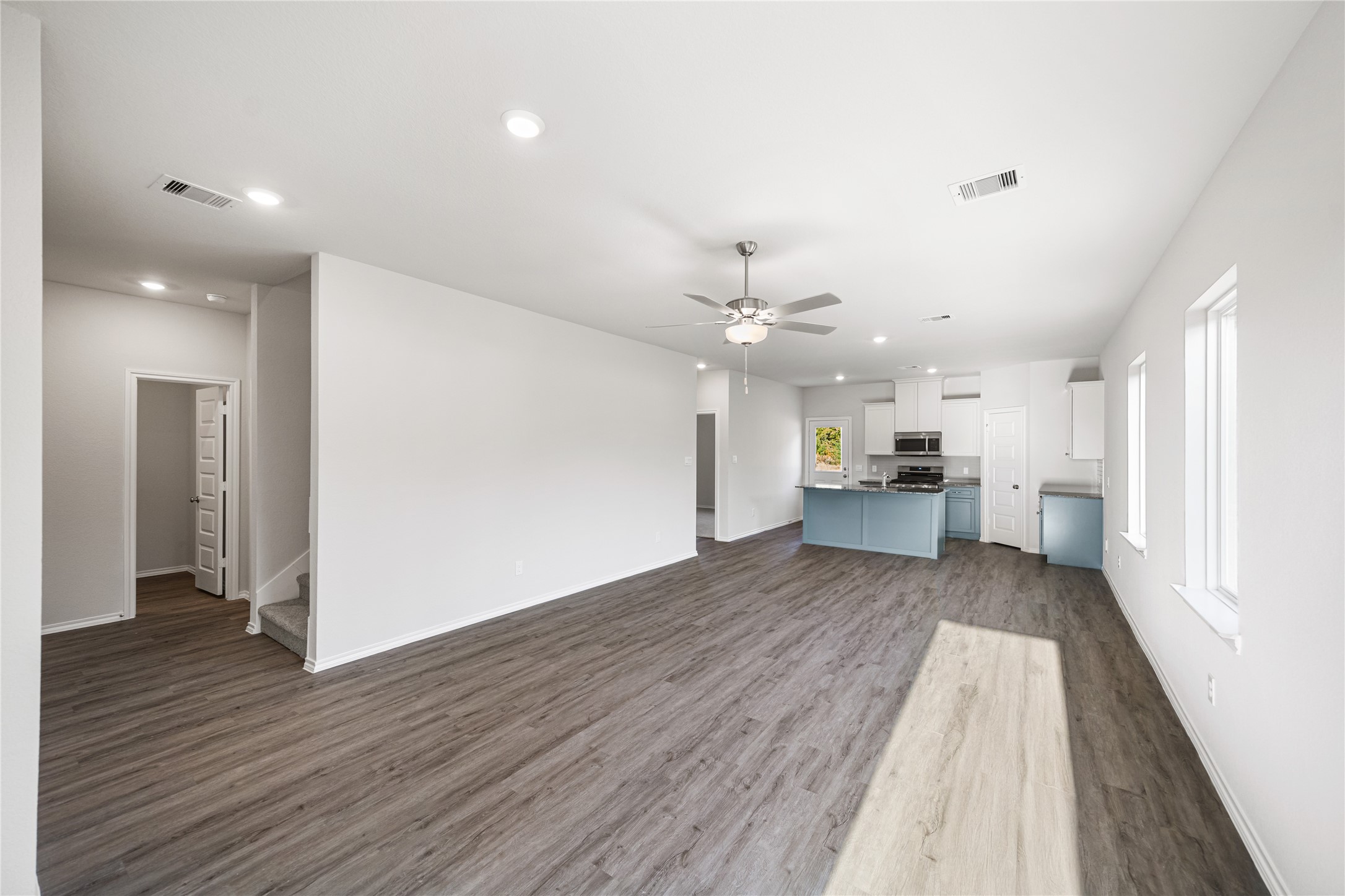 25799 John Wayne Court Splendora, TX 77372 - Photo 5 of 28 a view of a living room with wooden floor