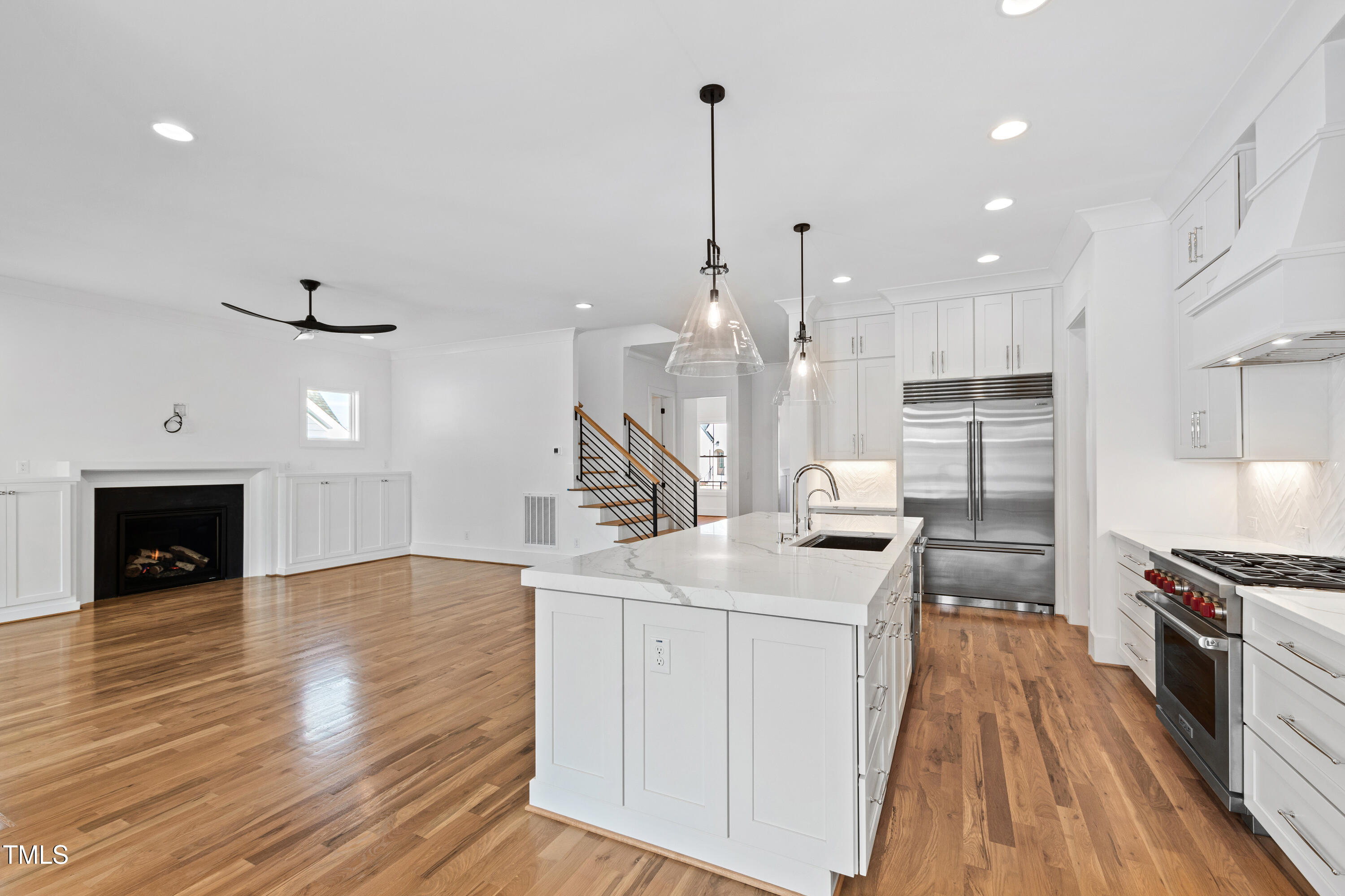 920 Lily Claire Lane Fuquay-Varina, NC 27526 - Photo 18 of 62 a kitchen with a sink appliances and cabinets