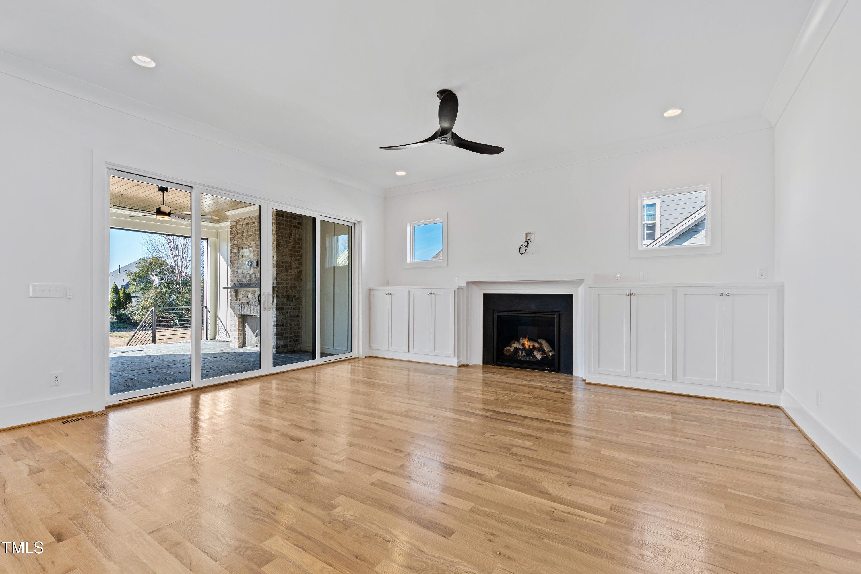 920 Lily Claire Lane Fuquay-Varina, NC 27526 - Photo 19 of 62 a view of an empty room with a fireplace and a window
