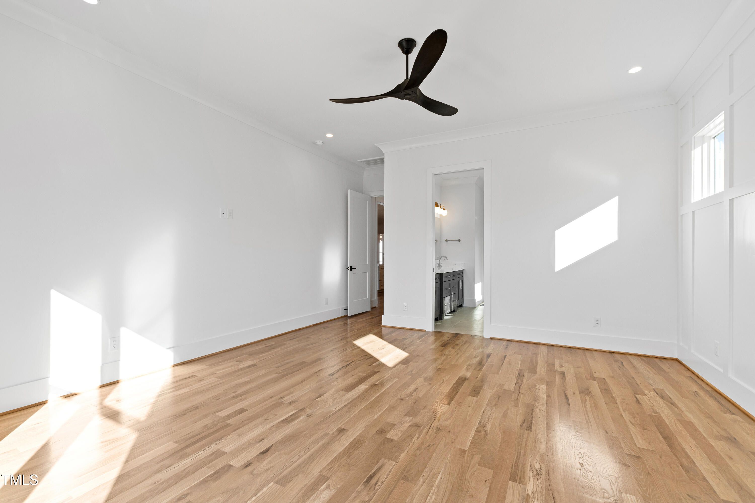 920 Lily Claire Lane Fuquay-Varina, NC 27526 - Photo 22 of 62 a view of empty room with wooden floor and fan