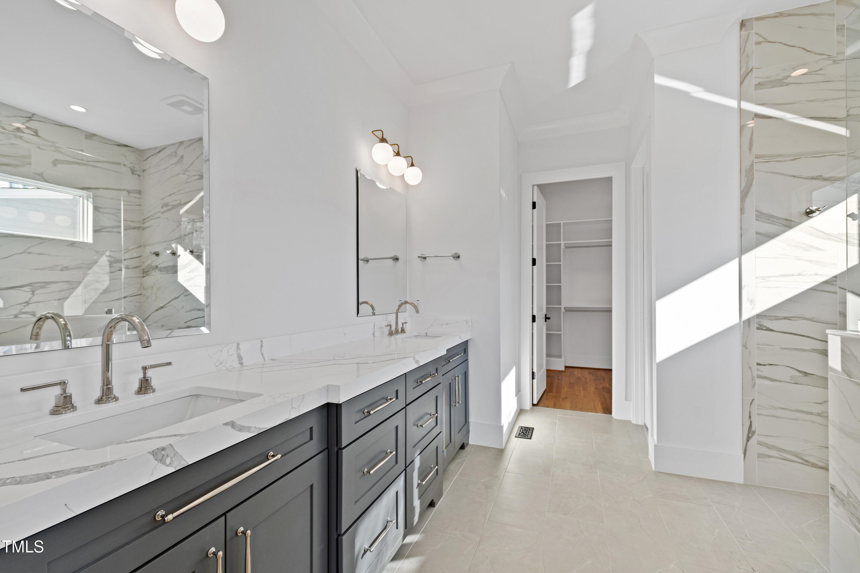920 Lily Claire Lane Fuquay-Varina, NC 27526 - Photo 23 of 62 a spacious bathroom with double sink and a mirror