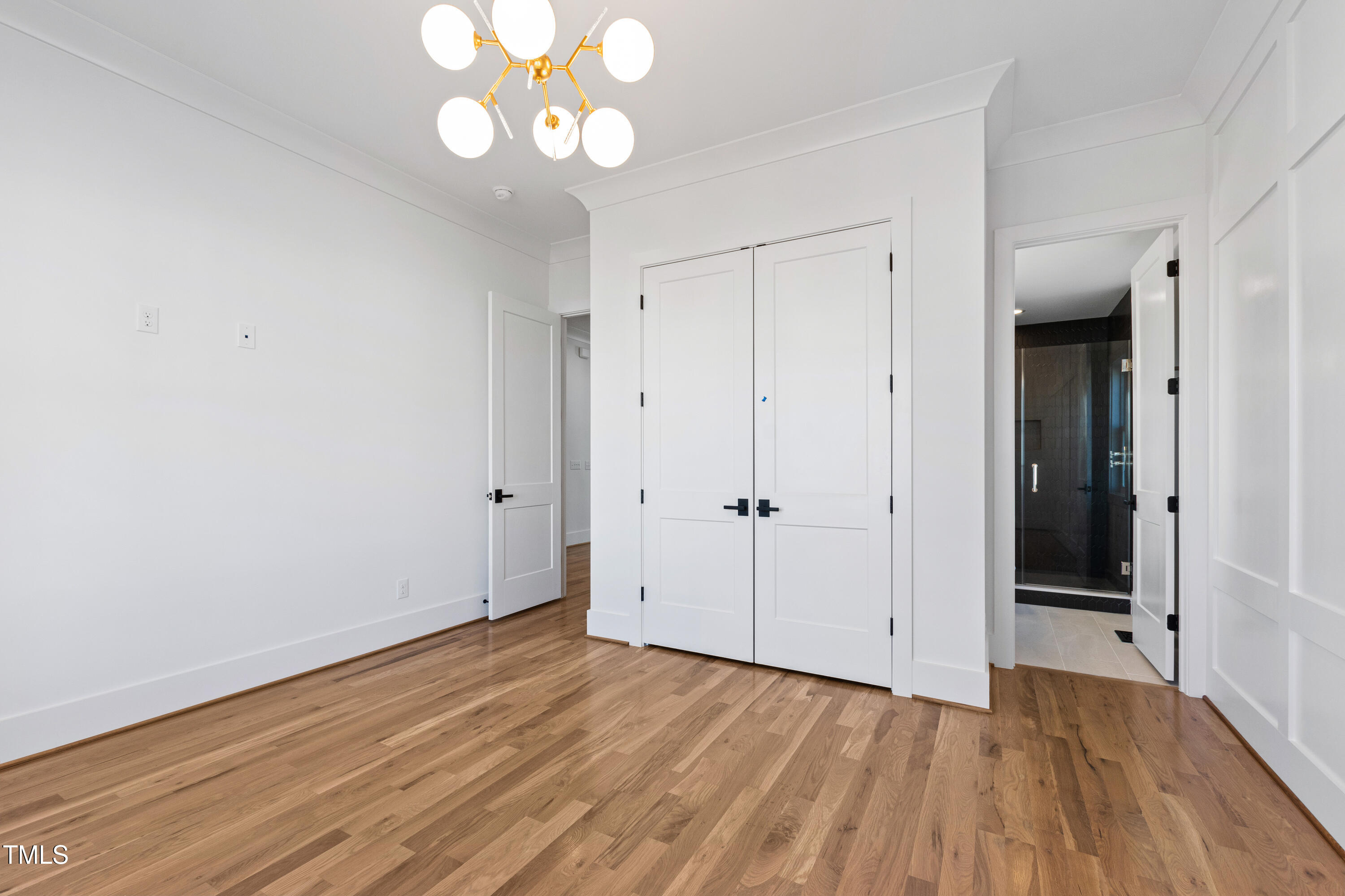 920 Lily Claire Lane Fuquay-Varina, NC 27526 - Photo 29 of 62 a view of an empty room with wooden floor