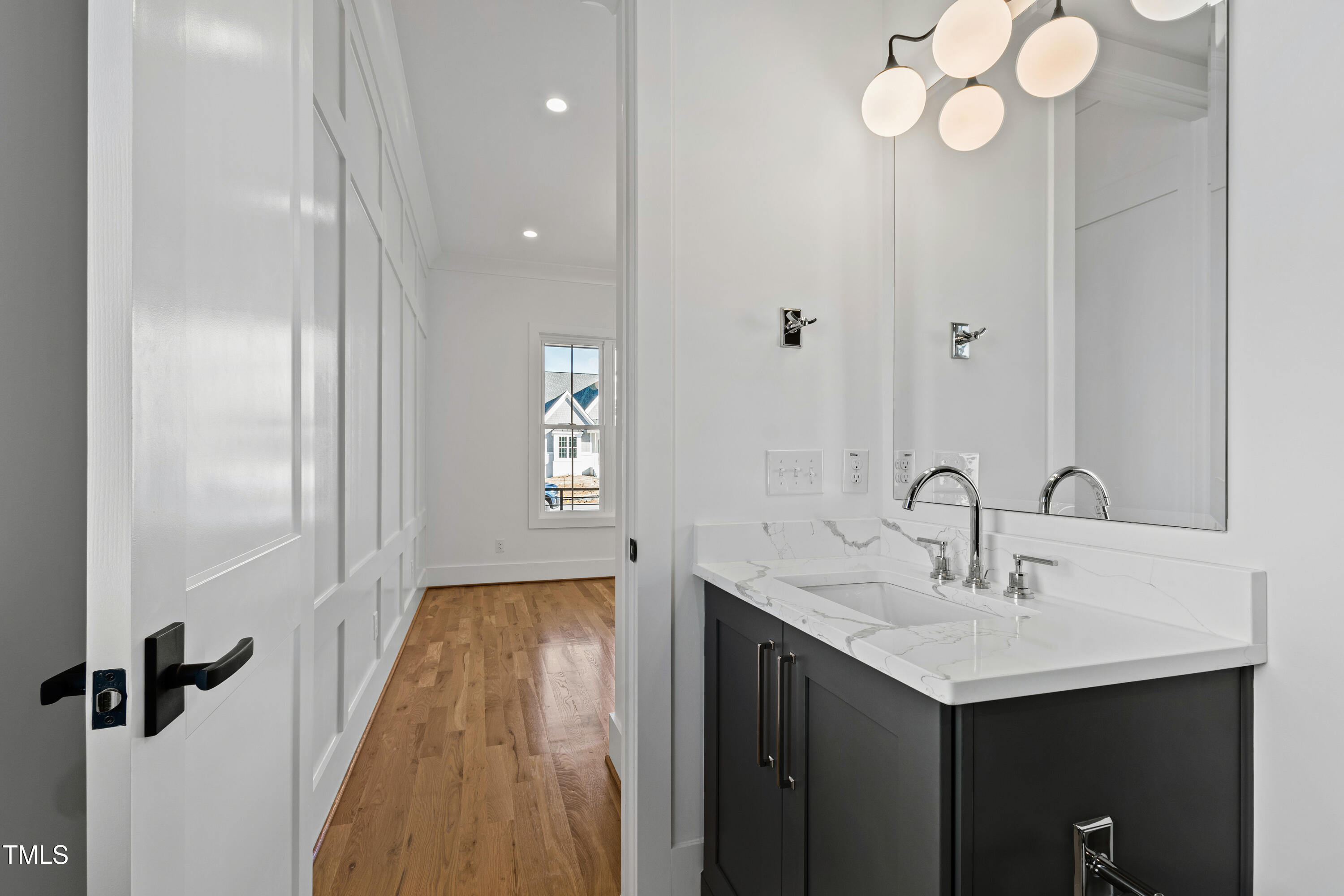 920 Lily Claire Lane Fuquay-Varina, NC 27526 - Photo 30 of 62 a bathroom with a sink and a mirror