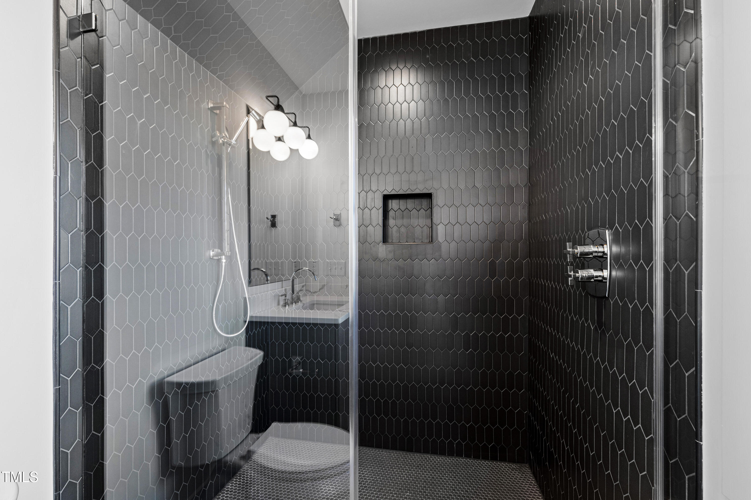 920 Lily Claire Lane Fuquay-Varina, NC 27526 - Photo 31 of 62 a bathroom with a toilet and a shower