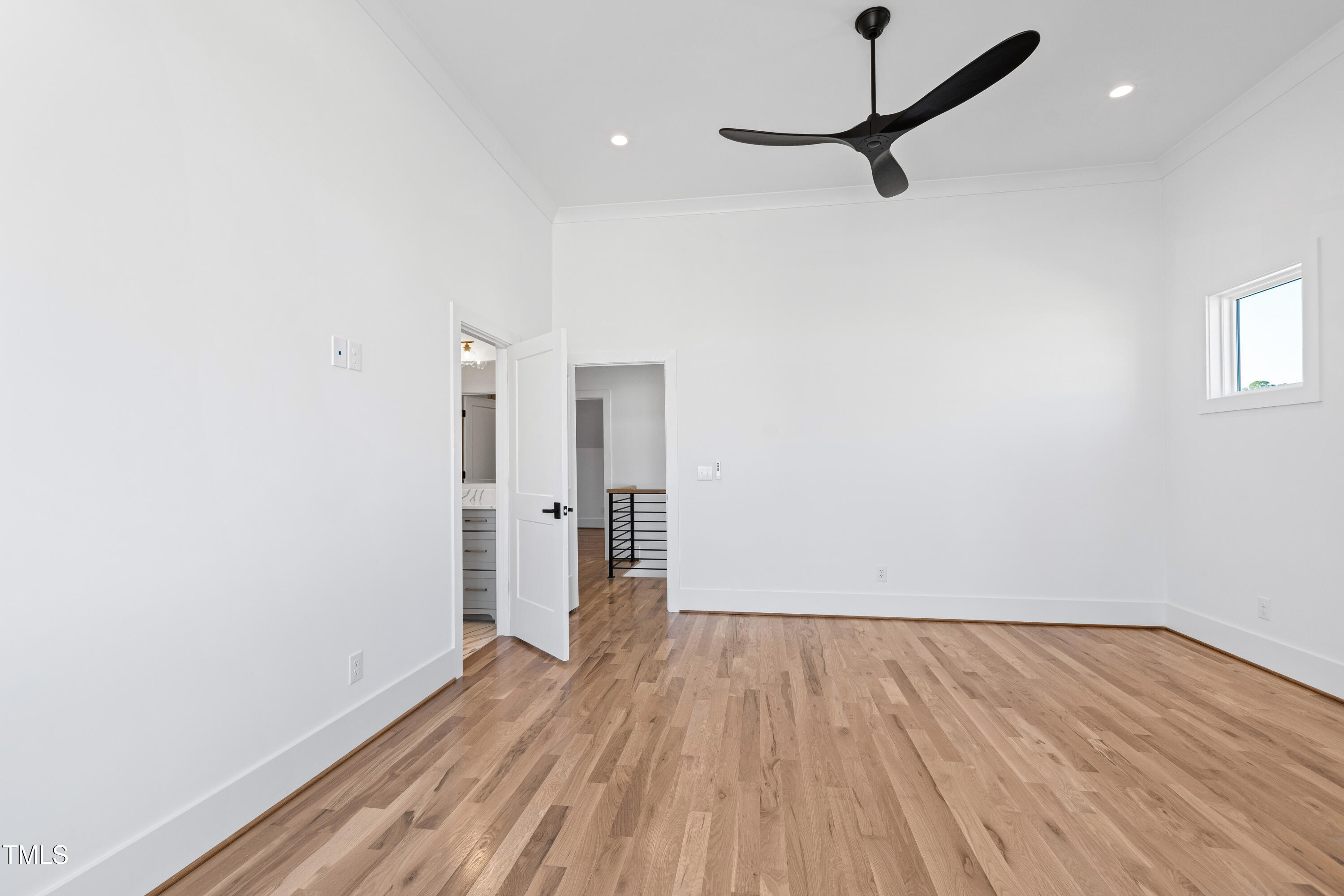 920 Lily Claire Lane Fuquay-Varina, NC 27526 - Photo 35 of 62 a view of a room with wooden floor and white walls