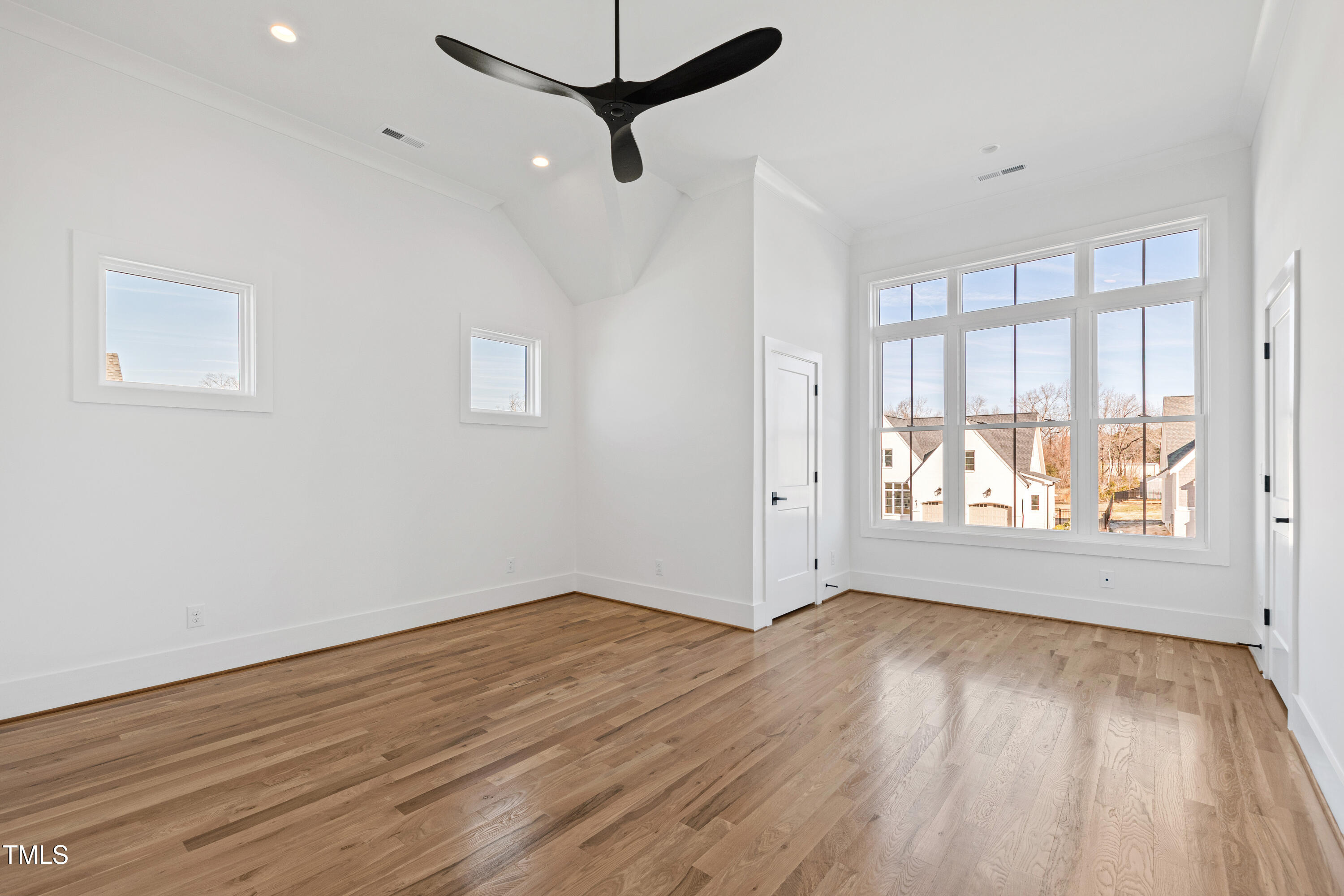 920 Lily Claire Lane Fuquay-Varina, NC 27526 - Photo 36 of 62 wooden floor in an empty room with a window