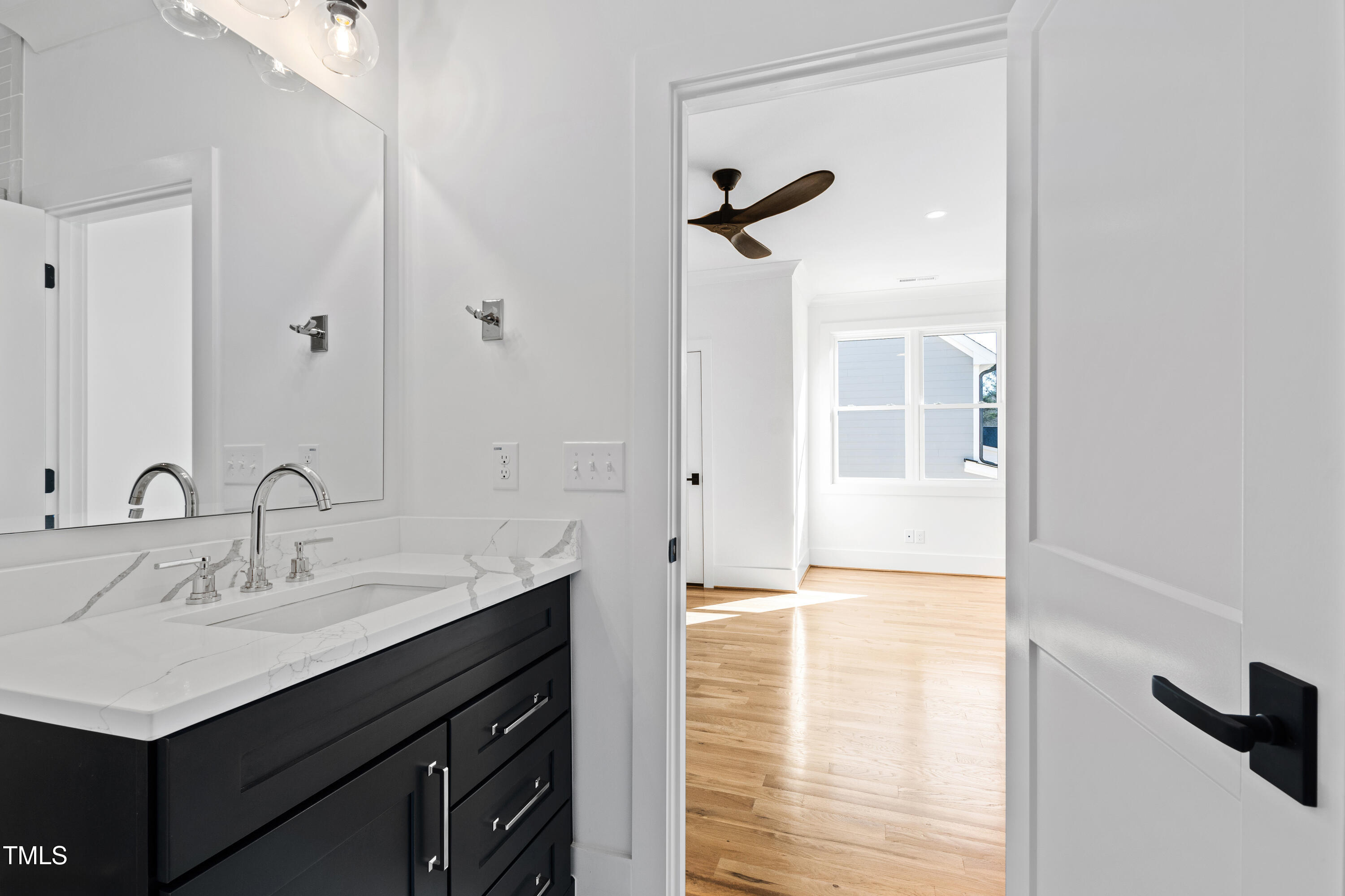 920 Lily Claire Lane Fuquay-Varina, NC 27526 - Photo 44 of 62 a bathroom with a sink and a mirror