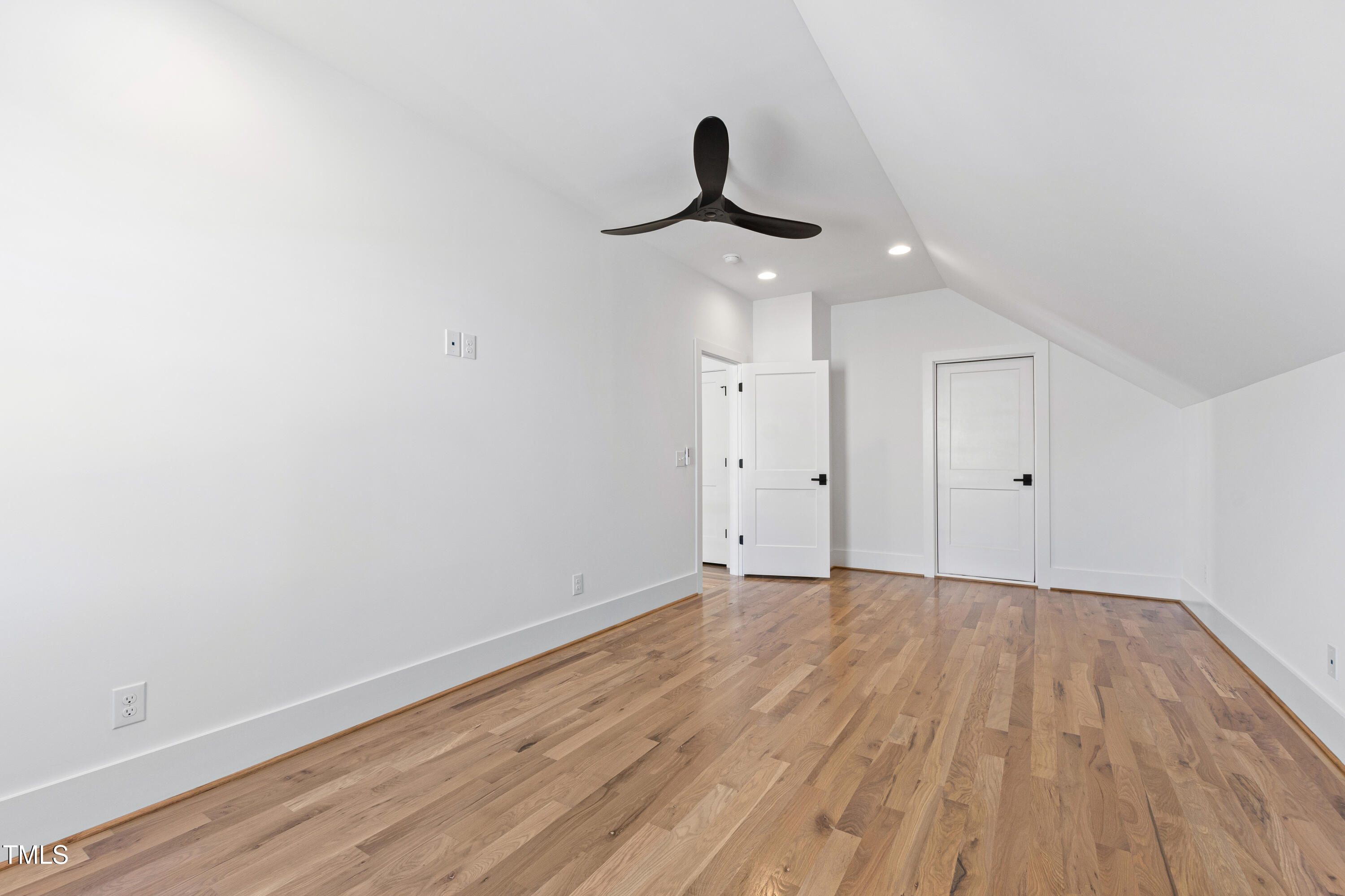 920 Lily Claire Lane Fuquay-Varina, NC 27526 - Photo 47 of 62 a view of an empty room with a chandelier fan