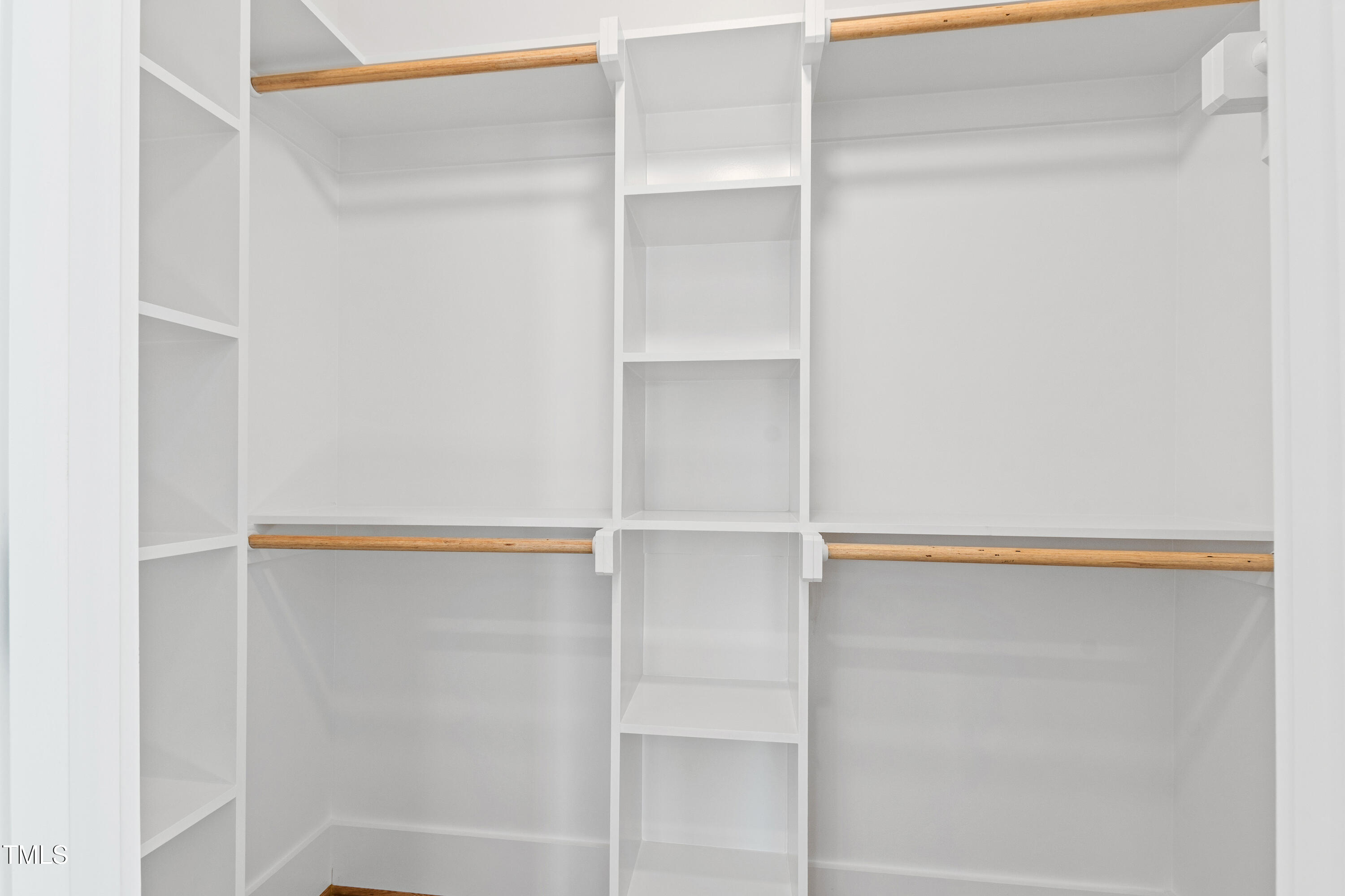 920 Lily Claire Lane Fuquay-Varina, NC 27526 - Photo 48 of 62 a close view of closet with racks on the wall