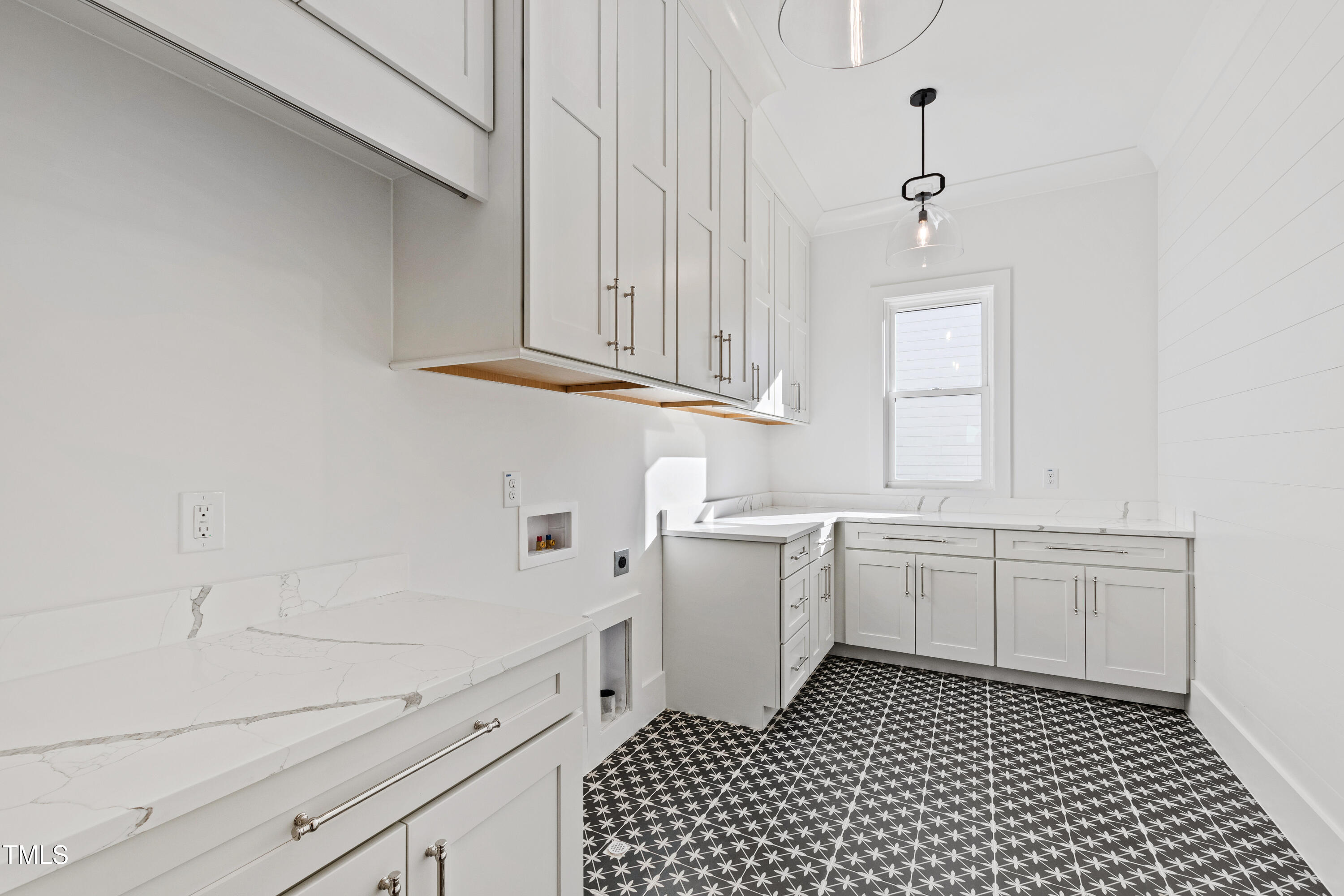 920 Lily Claire Lane Fuquay-Varina, NC 27526 - Photo 51 of 62 a kitchen with granite countertop white cabinets and white appliances