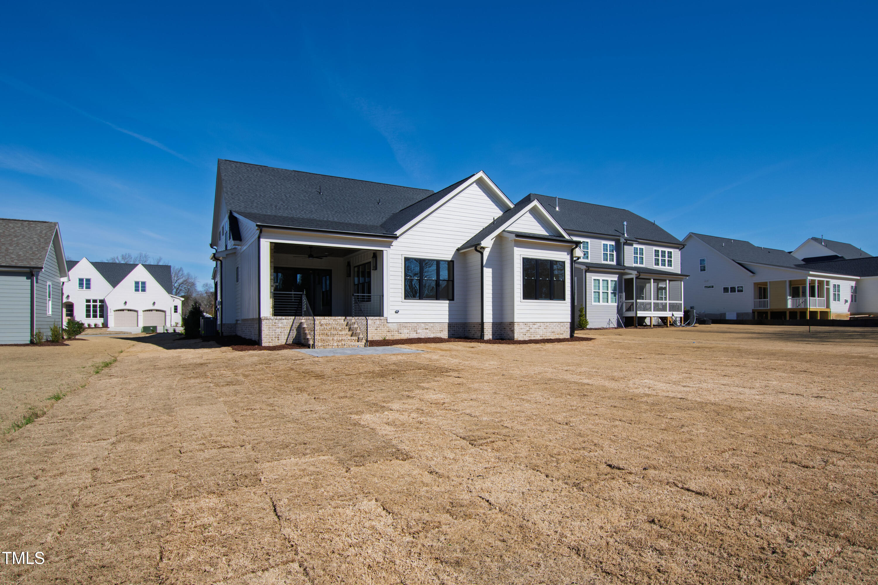 920 Lily Claire Lane Fuquay-Varina, NC 27526 - Photo 57 of 62 a front view of a house with a large tree in front of it