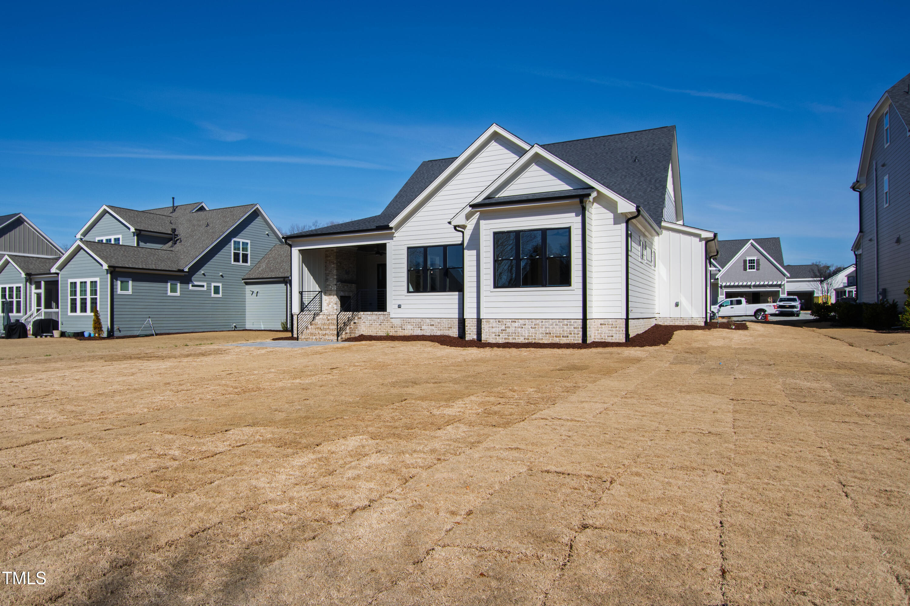 920 Lily Claire Lane Fuquay-Varina, NC 27526 - Photo 58 of 62 a view of a house with a yard