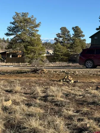 a view of car parked on the side of the road