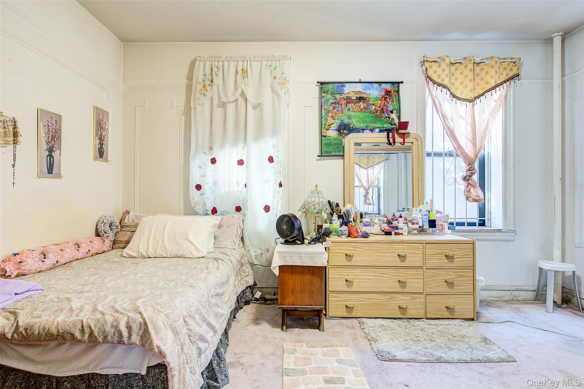 41-41 41st Street, Unit 1G Queens, NY 11104 - Photo 12 of 29 a bedroom with a bed and wooden floor