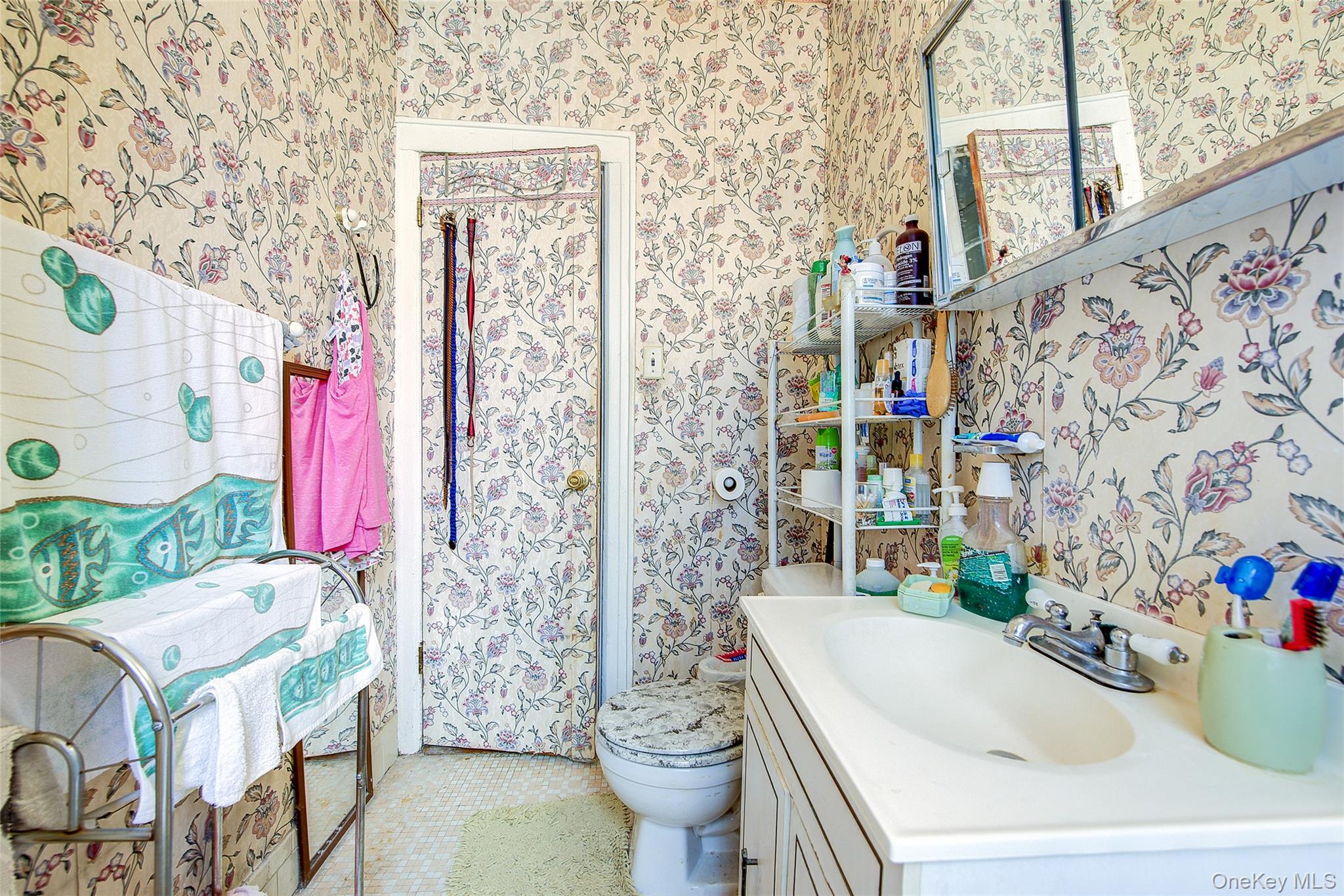 41-41 41st Street, Unit 1G Queens, NY 11104 - Photo 17 of 29 a bathroom with a sink toilet and shower