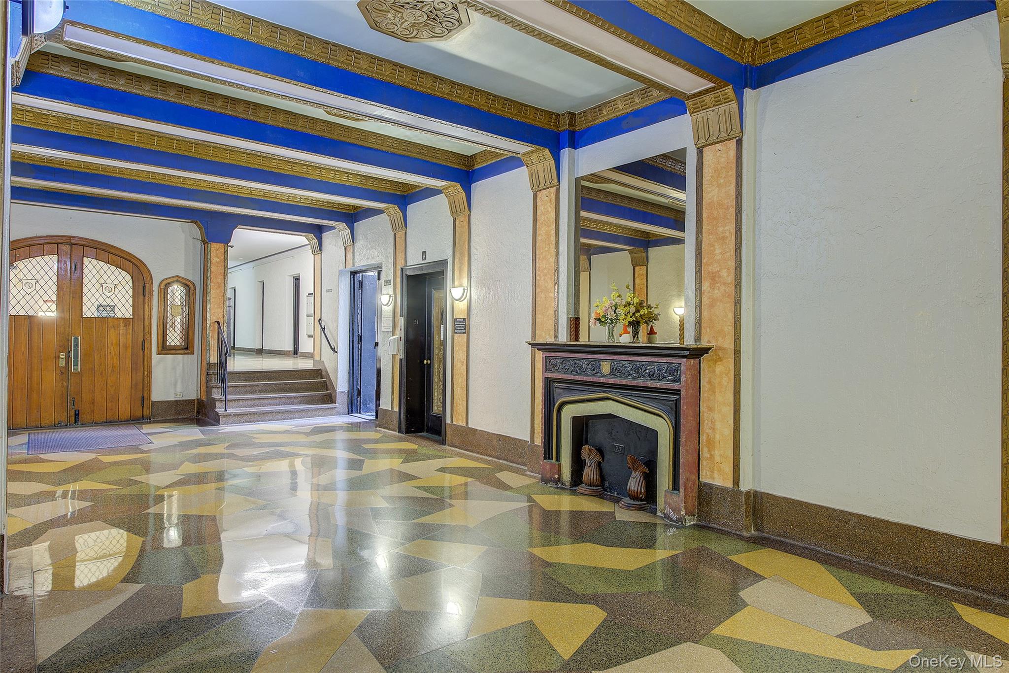 41-41 41st Street, Unit 1G Queens, NY 11104 - Photo 22 of 29 a living room with a fireplace furniture a rug and a fireplace