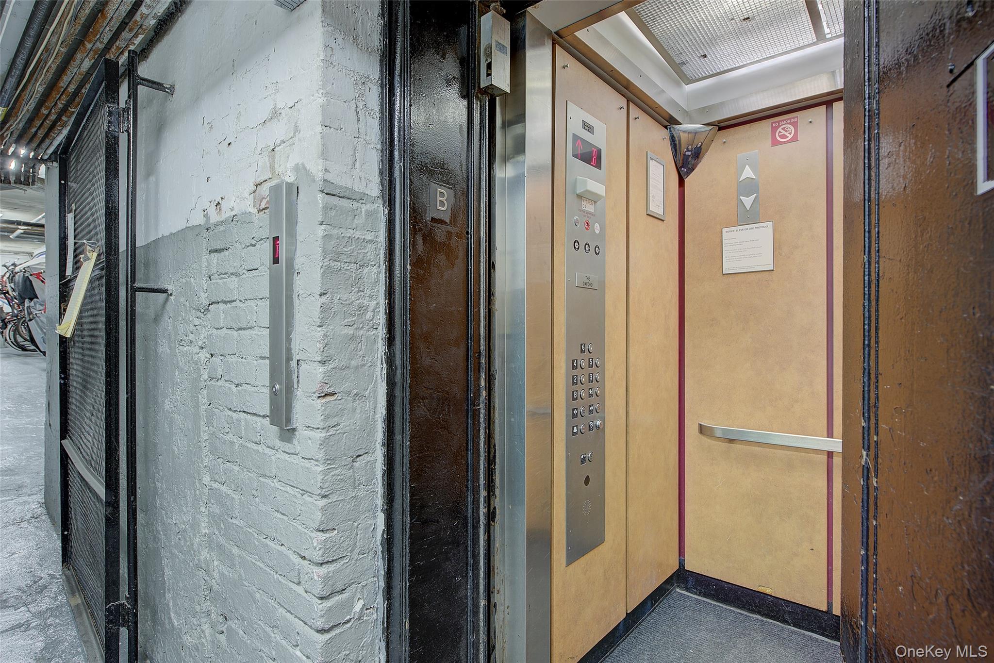41-41 41st Street, Unit 1G Queens, NY 11104 - Photo 24 of 29 a bathroom with a glass shower door and a glass door