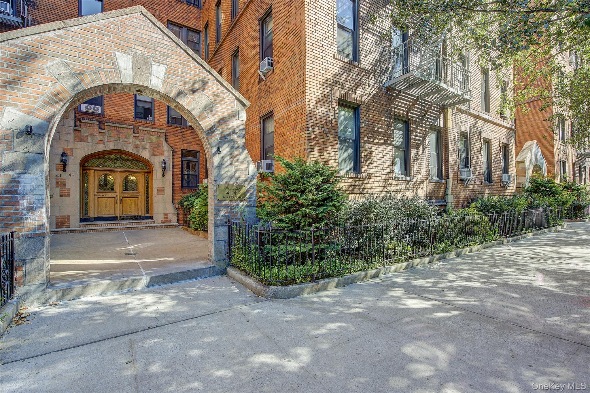 41-41 41st Street, Unit 1G Queens, NY 11104 - Photo 29 of 29 a front view of a house with garden