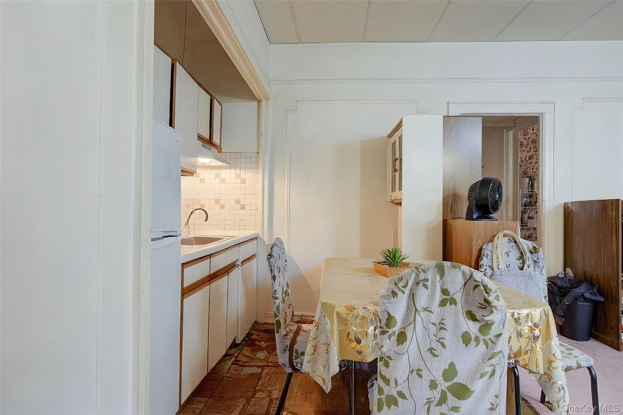 41-41 41st Street, Unit 1G Queens, NY 11104 - Photo 4 of 29 a bathroom with a sink and mirror