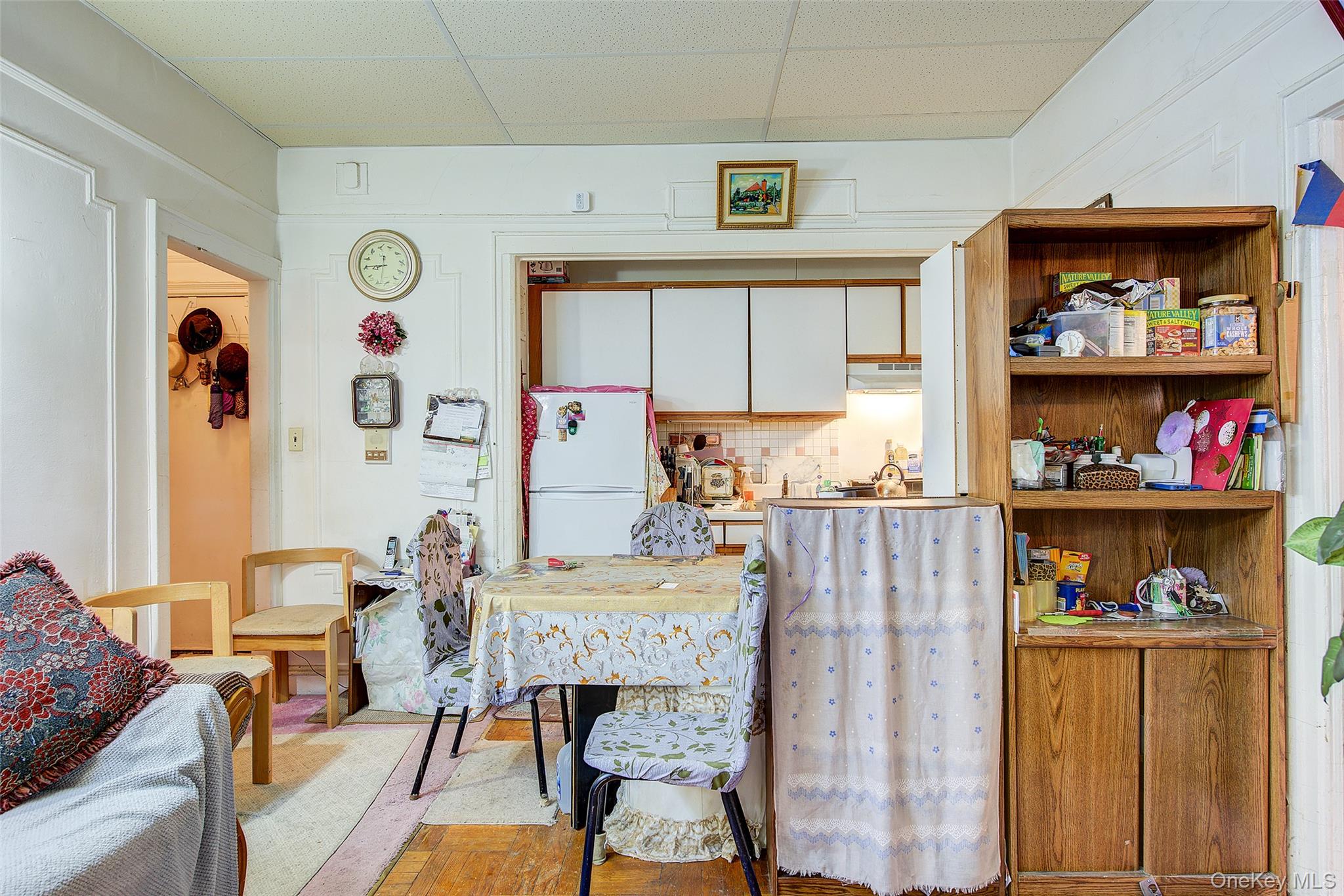 41-41 41st Street, Unit 1G Queens, NY 11104 - Photo 5 of 29 a living room with furniture and a wooden floor