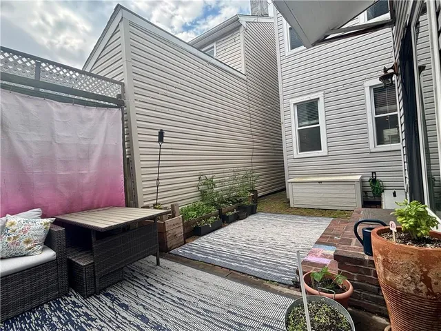 view of a closet and a mirror in a room