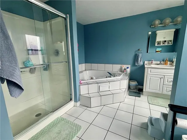 a kitchen with a sink and a stove next to a window