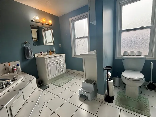 a kitchen with a sink a refrigerator and a stove