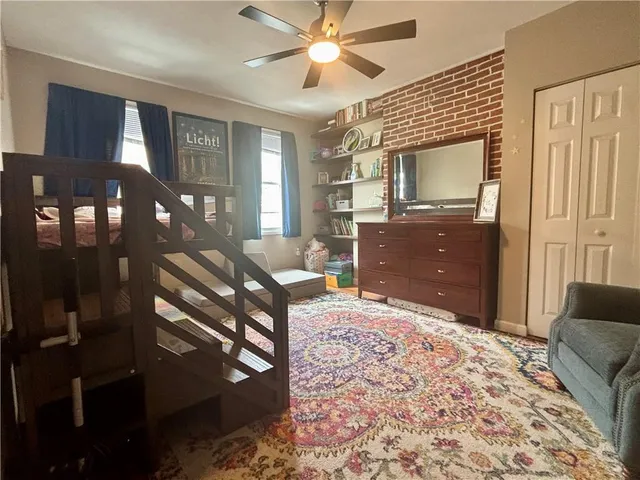 a bedroom with furniture and a bed