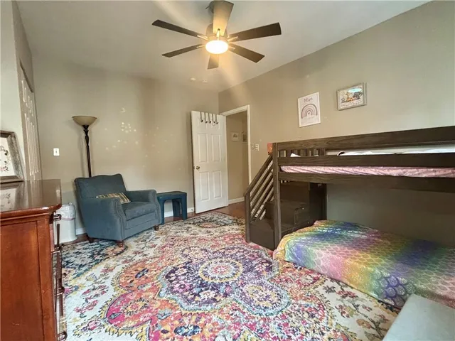 a bathroom with a toilet and a shower curtain