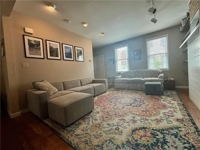 a bedroom with a large bed and a couch