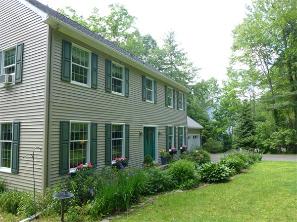 63 Stone Ridge Drive Northampton, MA 01062 - Photo 3 of 26 a house that has a lot of plants in it
