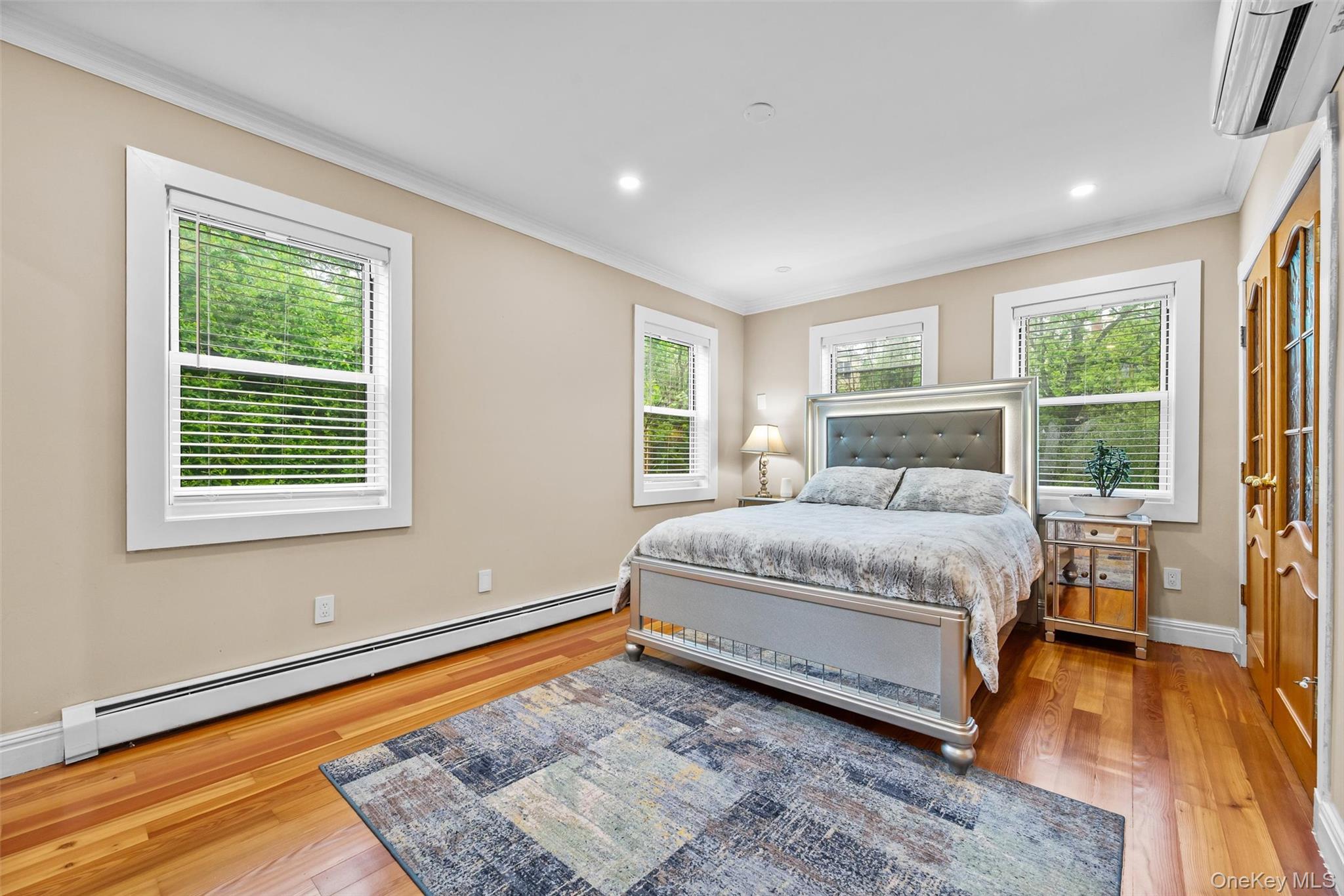 751 Rte 9W Fort Montgomery, NY 10922 - Photo 22 of 41 a bedroom with a bed and wooden floor