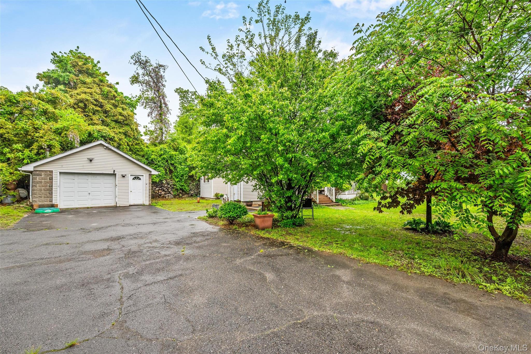 751 Rte 9W Fort Montgomery, NY 10922 - Photo 34 of 41 a view of a house with a yard and garage