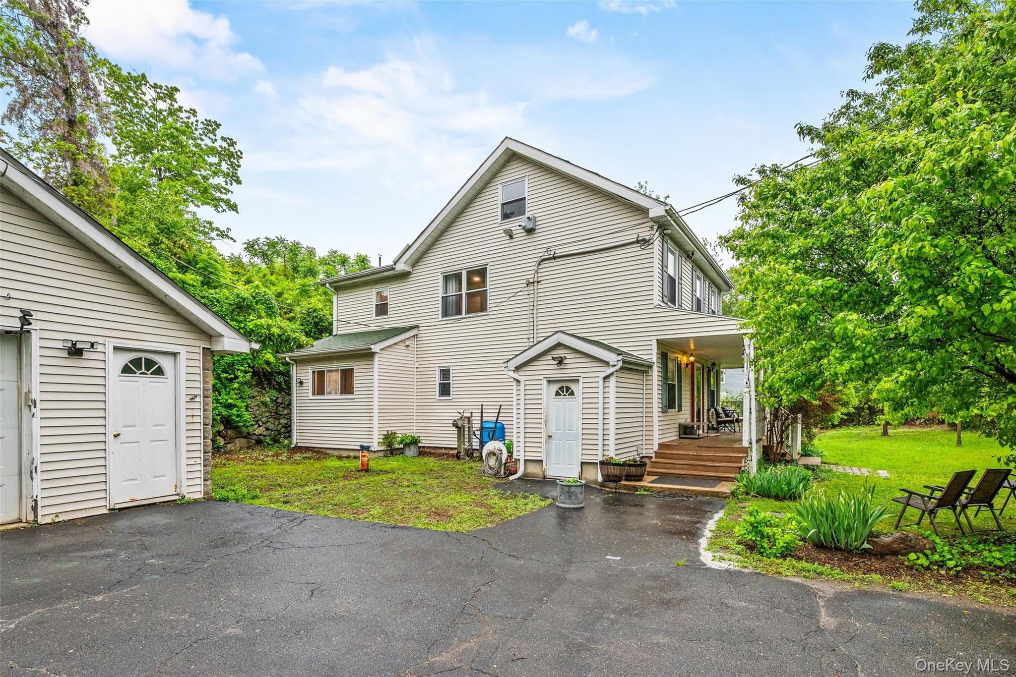 751 Rte 9W Fort Montgomery, NY 10922 - Photo 35 of 41 a front view of a house with a yard and garage