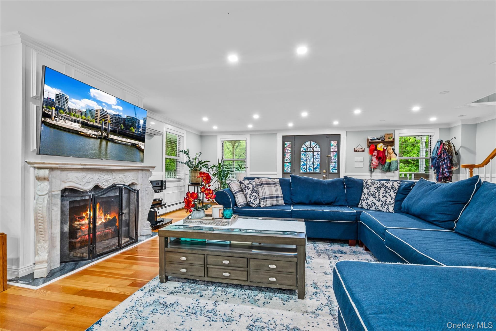 751 Rte 9W Fort Montgomery, NY 10922 - Photo 10 of 41 a living room with furniture a fireplace and a flat screen tv