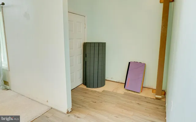 a view of a room with wooden floor