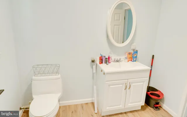 a bathroom with a toilet and a mirror