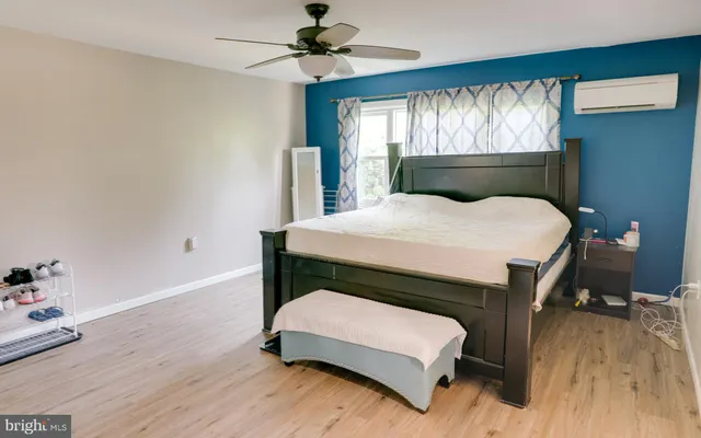 a room with a bed and a chandelier