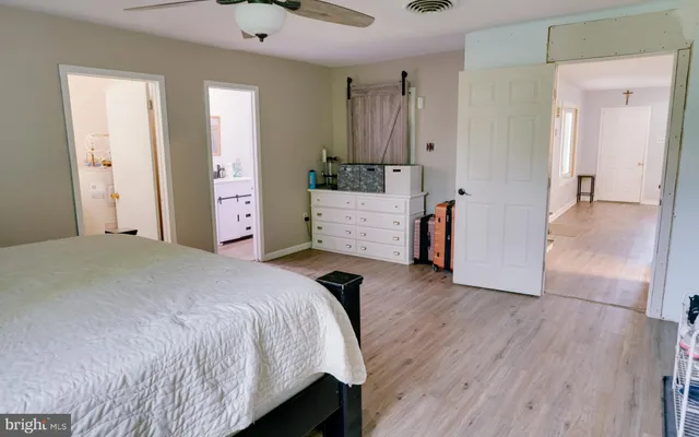 a bedroom with a bed and a dresser