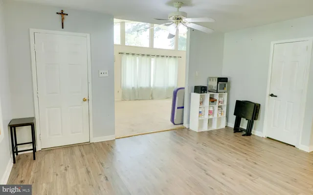 a view of a livingroom with furniture and a window