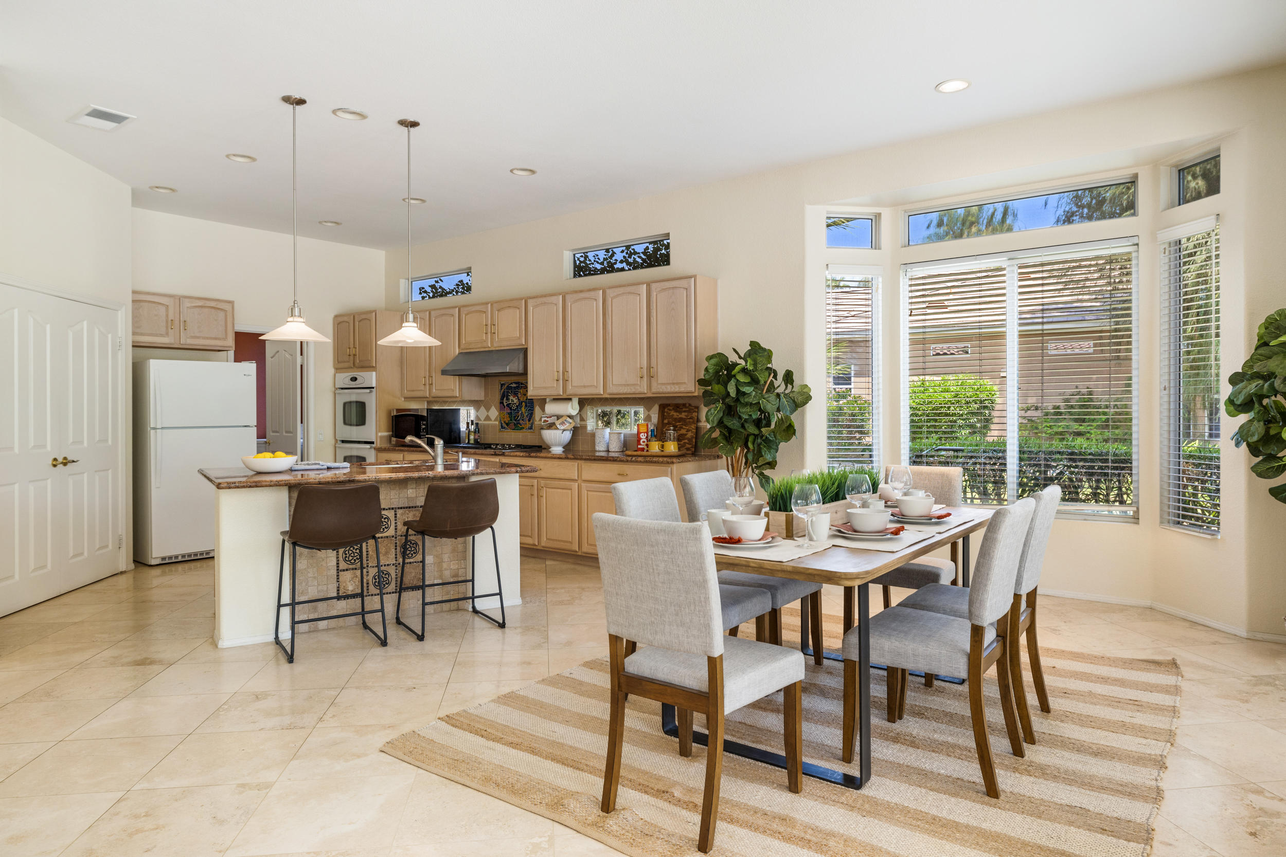 44410 Royal Lytham Drive Indio, CA 92201 - Photo 12 of 72 a dining room with furniture and wooden floor