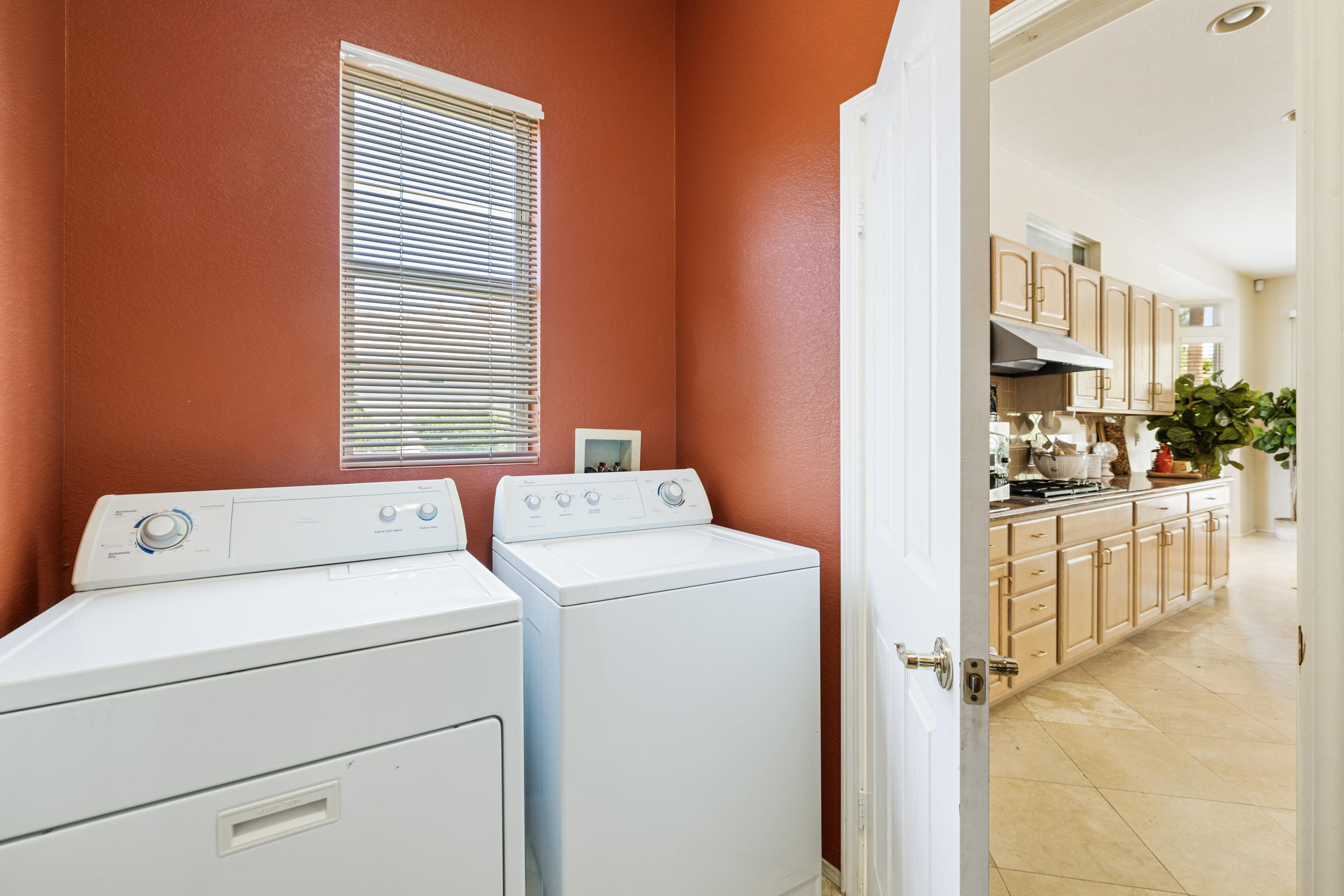 44410 Royal Lytham Drive Indio, CA 92201 - Photo 19 of 72 a utility room with dryer and washer