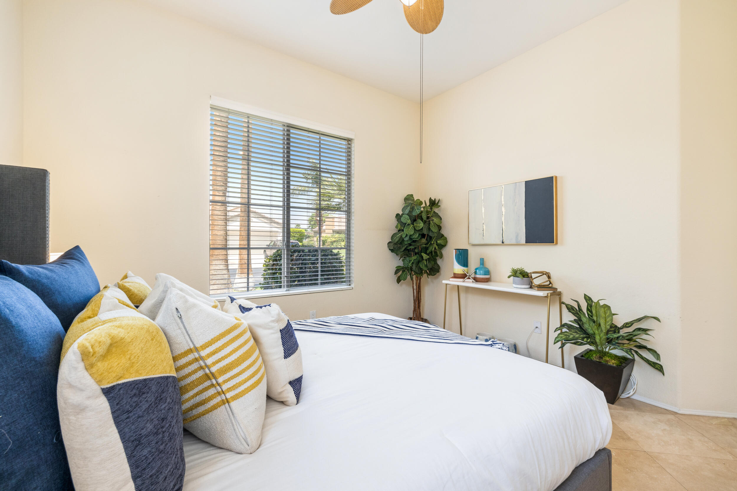 44410 Royal Lytham Drive Indio, CA 92201 - Photo 22 of 72 a spacious bedroom with a bed and a table