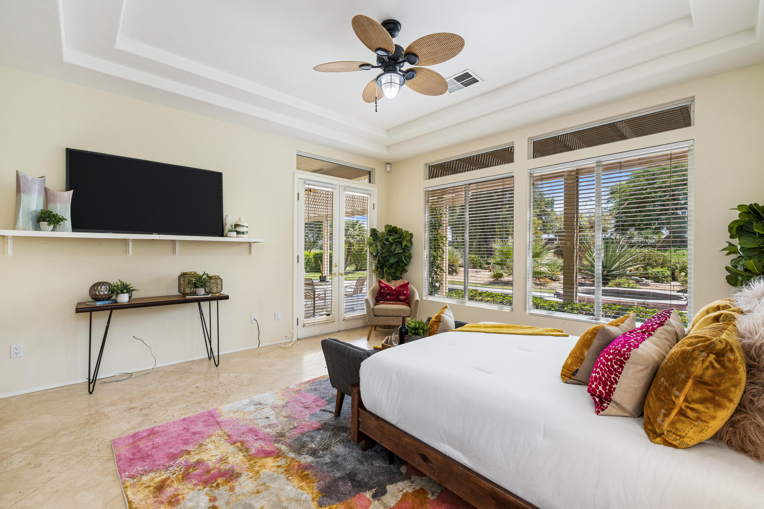 44410 Royal Lytham Drive Indio, CA 92201 - Photo 26 of 72 a bedroom with a bed window and a flat screen tv