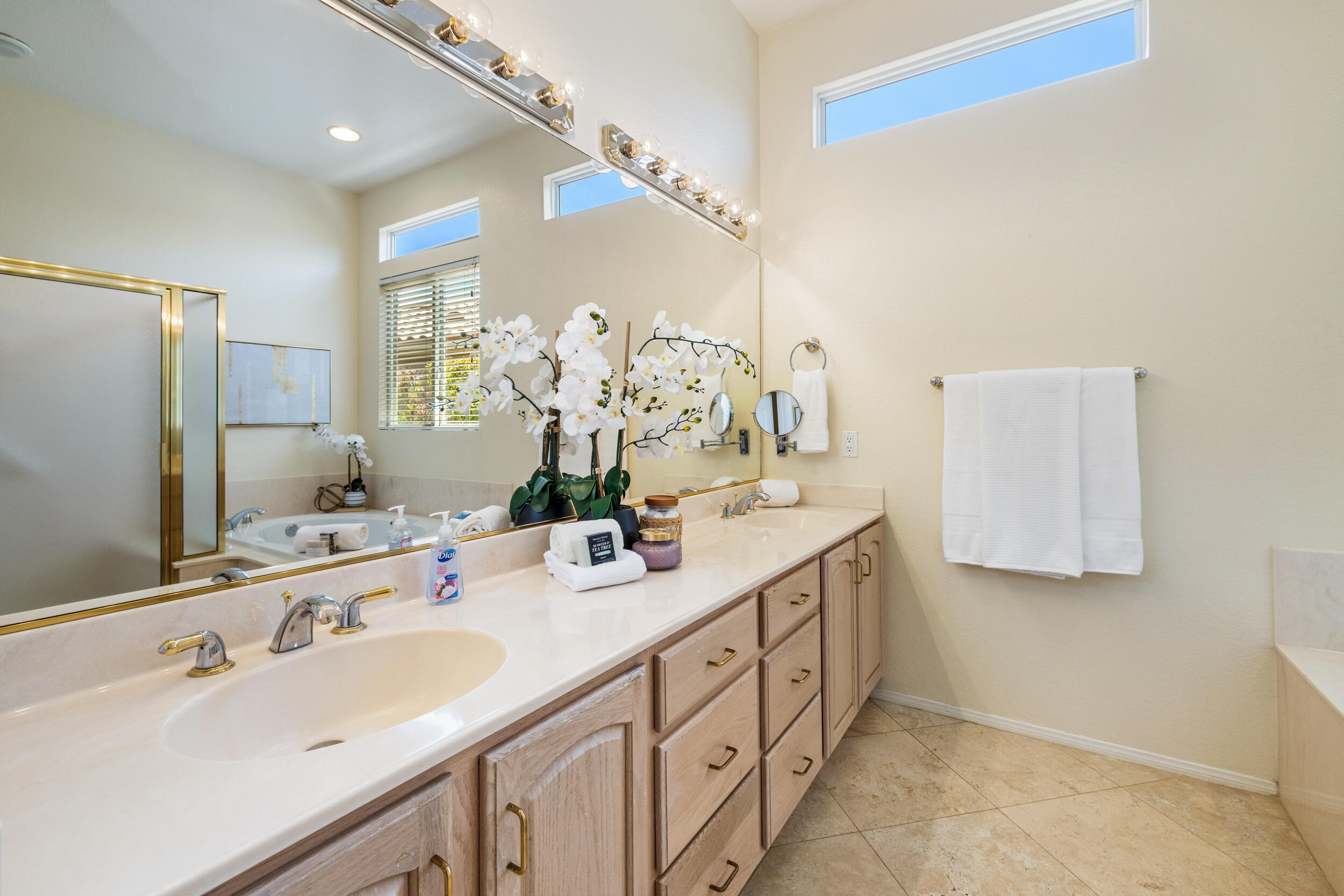 44410 Royal Lytham Drive Indio, CA 92201 - Photo 29 of 72 a bathroom with double vanity and a mirror